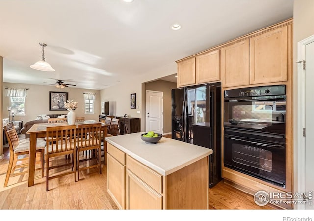 13065 Tamarac Pl, Thornton, CO 80602 - kitchen with black appliances, light brown cabinets, open floor plan, light wood finished floors, and recessed lighting