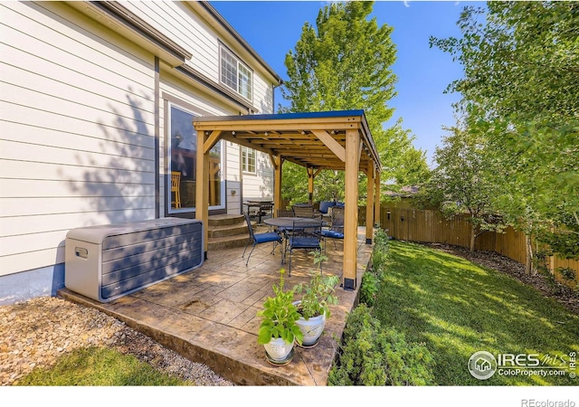 13065 Tamarac Pl, Thornton, CO 80602 - fenced backyard with a patio area