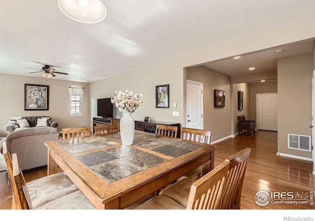 13065 Tamarac Pl, Thornton, CO 80602 - dining space with wood finished floors and a ceiling fan