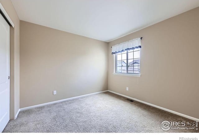 13065 Tamarac Pl, Thornton, CO 80602 - spare room featuring carpet floors and baseboards