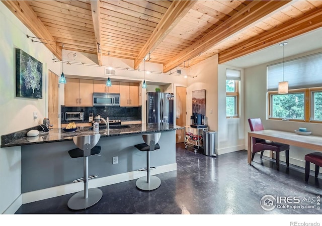 801 Confidence Dr Unit 16, Longmont, CO 80504 - kitchen with stainless steel microwave, freestanding refrigerator, decorative backsplash, a peninsula, and a wooden ceiling with exposed beams
