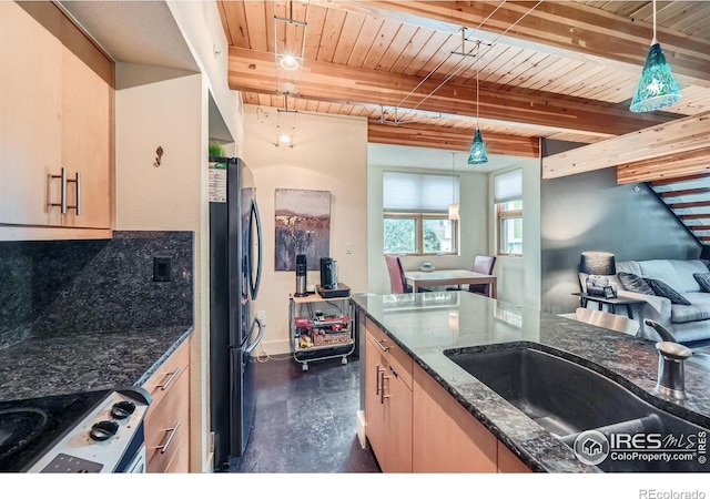 801 Confidence Dr Unit 16, Longmont, CO 80504 - kitchen featuring freestanding refrigerator, range, a wood ceiling with exposed beams, dark stone counters, and backsplash