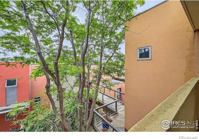 801 Confidence Dr Unit 16, Longmont, CO 80504 - view of property exterior featuring a balcony and stucco siding