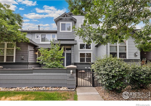 3686 Oakwood Dr, Longmont, CO 80503 - view of front of house with a fenced front yard and a gate