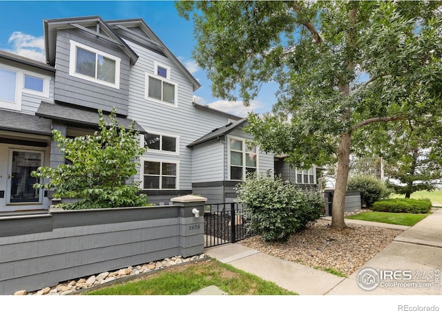 3686 Oakwood Dr, Longmont, CO 80503 - view of front facade with a fenced front yard and a gate