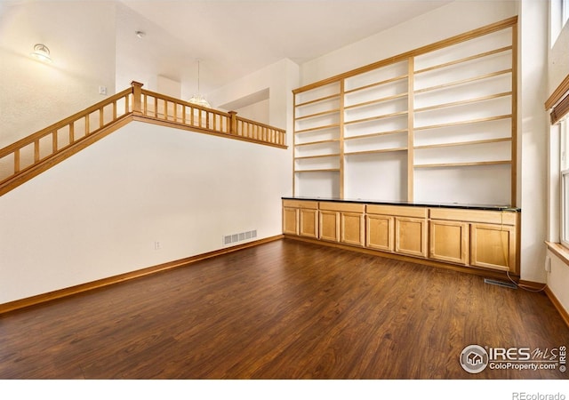 3686 Oakwood Dr, Longmont, CO 80503 - unfurnished room with dark wood-style flooring and baseboards