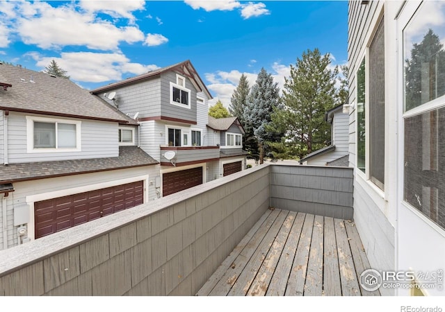 3686 Oakwood Dr, Longmont, CO 80503 - wooden terrace featuring a garage