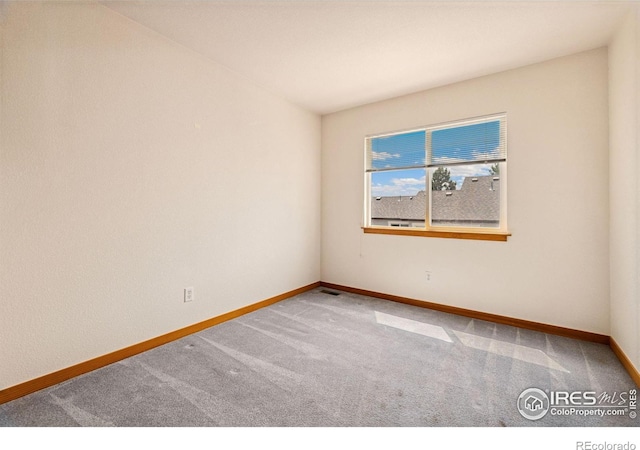 3686 Oakwood Dr, Longmont, CO 80503 - carpeted empty room featuring baseboards