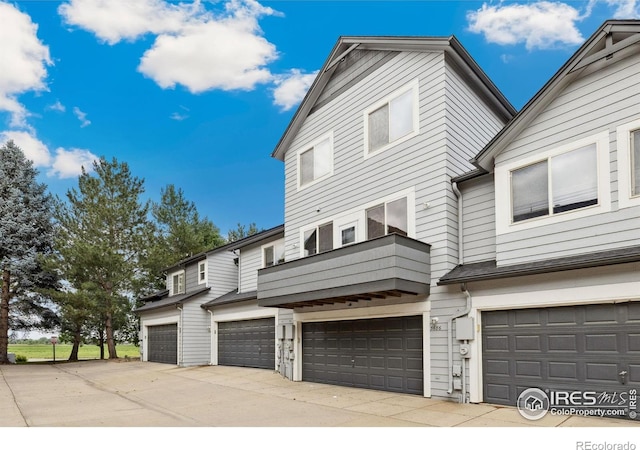 3686 Oakwood Dr, Longmont, CO 80503 - view of front of house with an attached garage and a balcony