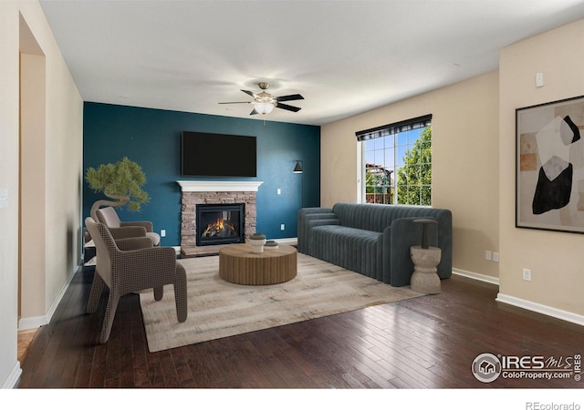 5049 S Ukraine St, Aurora, CO 80015 - living area featuring hardwood / wood-style flooring, ceiling fan, and a fireplace