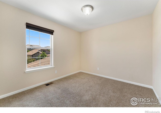 5049 S Ukraine St, Aurora, CO 80015 - spare room with carpet floors and baseboards