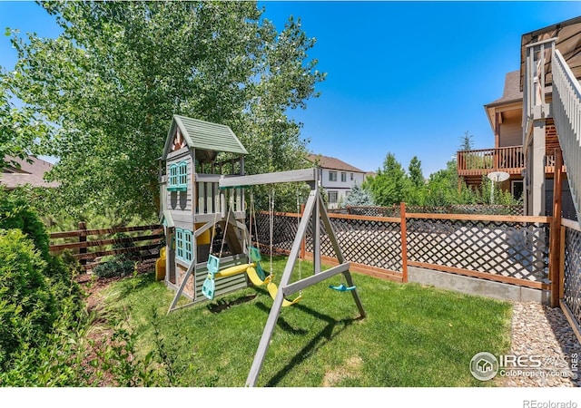 5049 S Ukraine St, Aurora, CO 80015 - fenced backyard featuring a playground