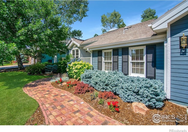 4471 Wellington Rd, Boulder, CO 80301 - view of exterior entry featuring a lawn