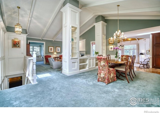 4471 Wellington Rd, Boulder, CO 80301 - dining room featuring a chandelier, plenty of natural light, carpet, and a decorative wall