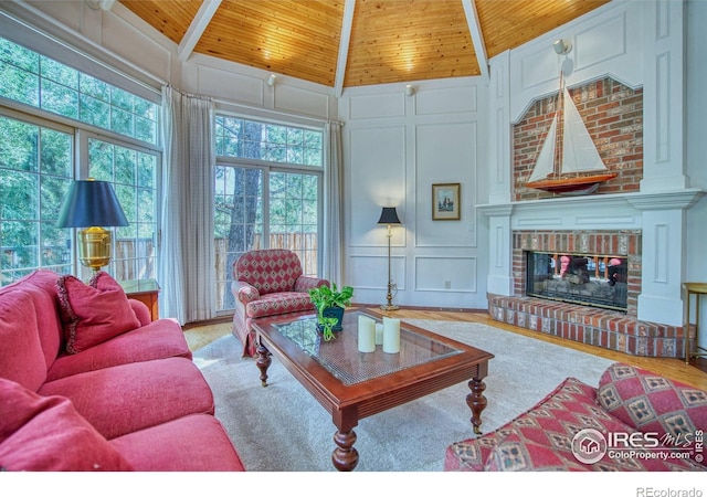 4471 Wellington Rd, Boulder, CO 80301 - living room with wooden ceiling, a decorative wall, wood finished floors, and a fireplace