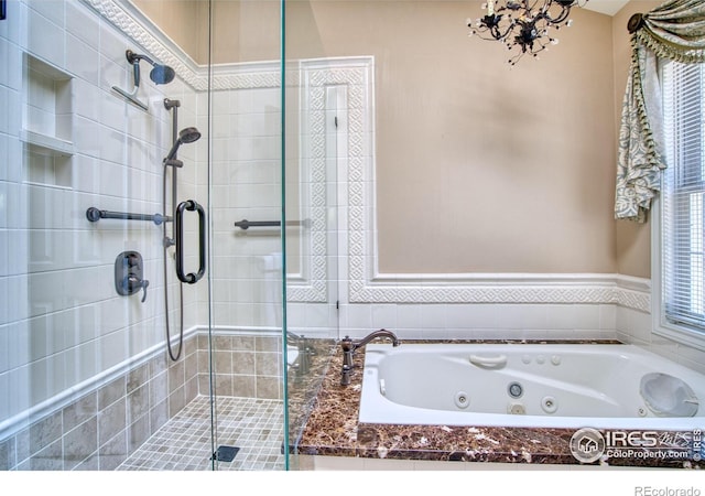 4471 Wellington Rd, Boulder, CO 80301 - bathroom featuring a stall shower, a whirlpool tub, and a chandelier