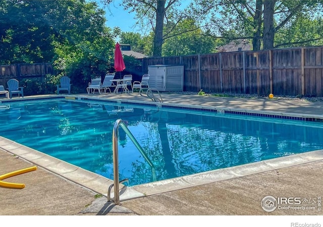 4471 Wellington Rd, Boulder, CO 80301 - community pool featuring a fenced backyard and a patio area