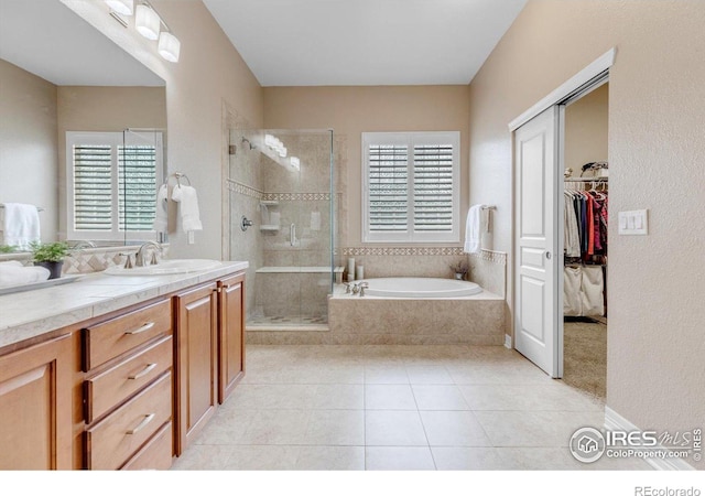 15002 Cosmos Way, Broomfield, CO 80023 - full bath with vanity, plenty of natural light, a shower stall, and a bath