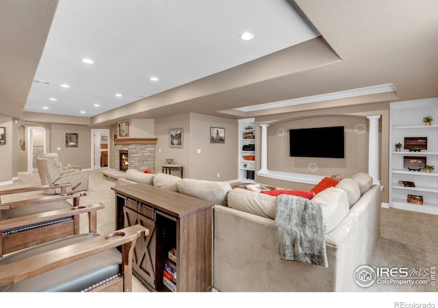 15002 Cosmos Way, Broomfield, CO 80023 - carpeted living room with a raised ceiling, arched walkways, built in shelves, and recessed lighting