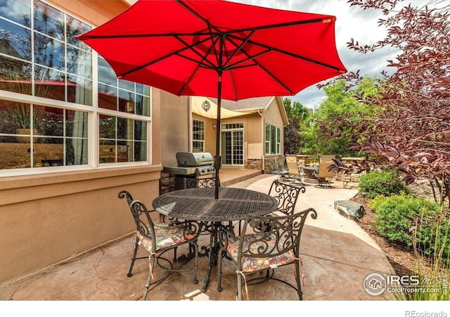 15002 Cosmos Way, Broomfield, CO 80023 - view of patio featuring outdoor dining area and a grill