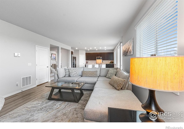 5766 Ranch St, Longmont, CO 80504 - living room featuring wood finished floors and recessed lighting