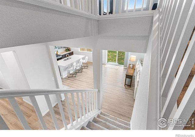 5766 Ranch St, Longmont, CO 80504 - stairs with wood finished floors and a towering ceiling