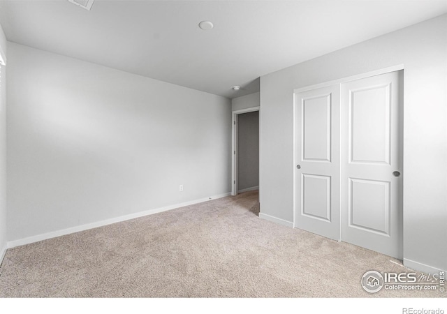 5766 Ranch St, Longmont, CO 80504 - unfurnished bedroom featuring carpet floors and a closet