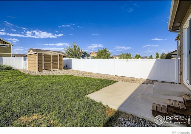 1541 Water Vista Ln, Severance, CO 80550 - fenced backyard featuring a patio area and a shed
