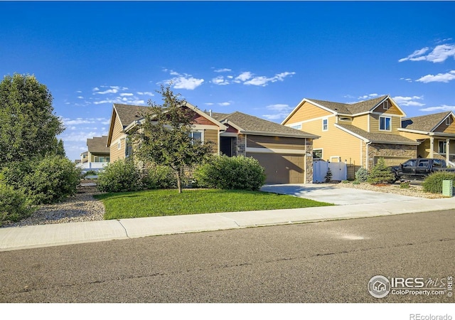 1541 Water Vista Ln, Severance, CO 80550 - view of front of property featuring an attached garage, driveway, a residential view, and a front lawn