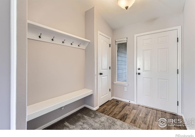 1541 Water Vista Ln, Severance, CO 80550 - mudroom featuring wood finished floors and baseboards