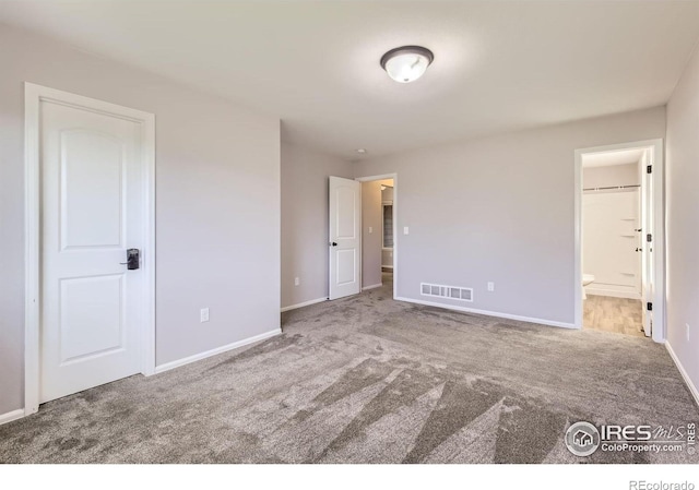 1541 Water Vista Ln, Severance, CO 80550 - unfurnished bedroom with carpet floors and connected bathroom