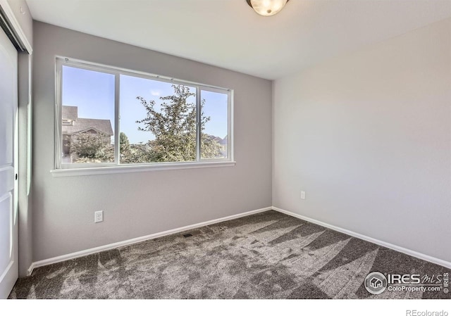 1541 Water Vista Ln, Severance, CO 80550 - carpeted spare room featuring baseboards
