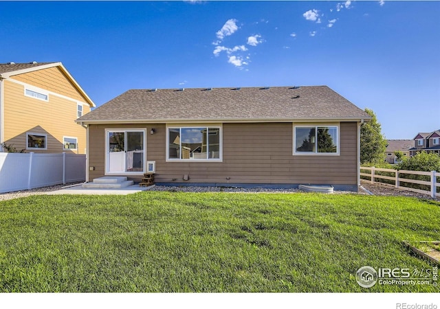1541 Water Vista Ln, Severance, CO 80550 - back of property featuring a fenced backyard and a shingled roof