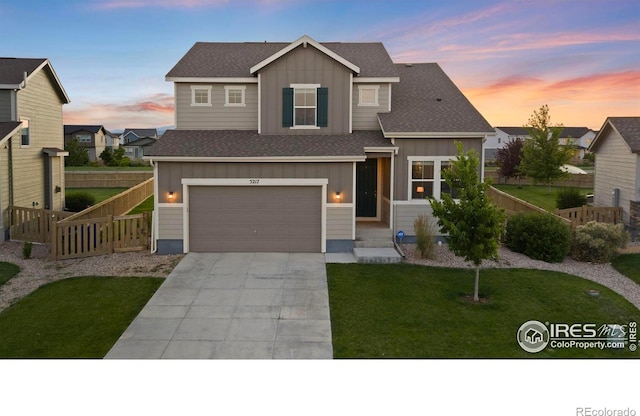 5217 Alberta Falls St, Timnath, CO 80547 - view of front facade with board and batten siding, concrete driveway, an attached garage, and roof with shingles