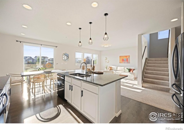 5217 Alberta Falls St, Timnath, CO 80547 - kitchen featuring dishwasher, stainless steel refrigerator, dark wood-style flooring, recessed lighting, and white cabinetry