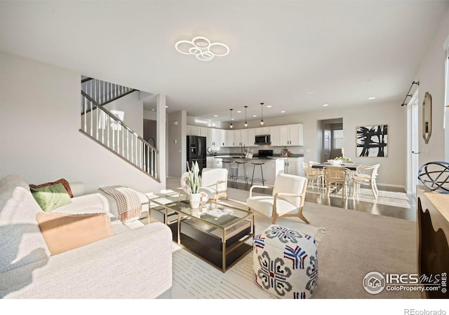 5217 Alberta Falls St, Timnath, CO 80547 - living room with stairway and recessed lighting