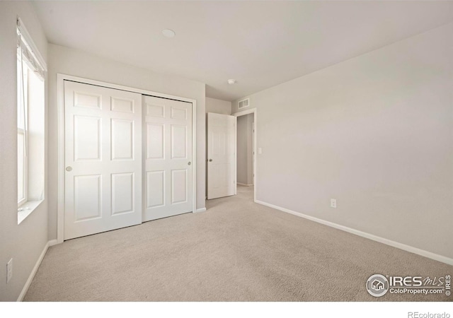 5217 Alberta Falls St, Timnath, CO 80547 - unfurnished bedroom featuring carpet floors and a closet
