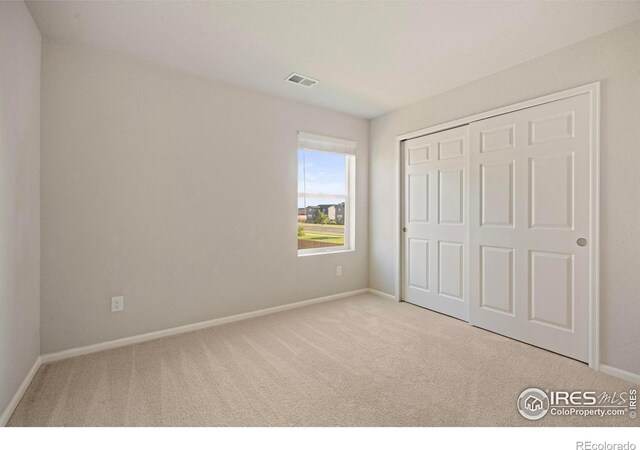 5217 Alberta Falls St, Timnath, CO 80547 - unfurnished bedroom with carpet floors and a closet