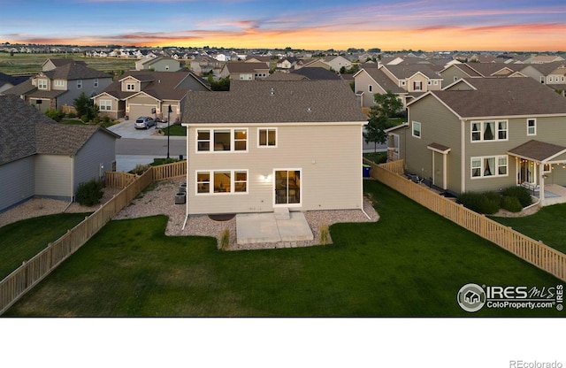 5217 Alberta Falls St, Timnath, CO 80547 - back of property featuring a residential view, a patio area, and a fenced backyard