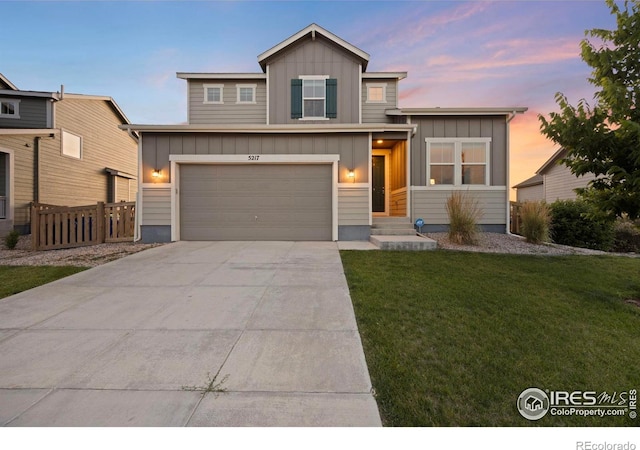5217 Alberta Falls St, Timnath, CO 80547 - view of front of property featuring board and batten siding, driveway, and a garage