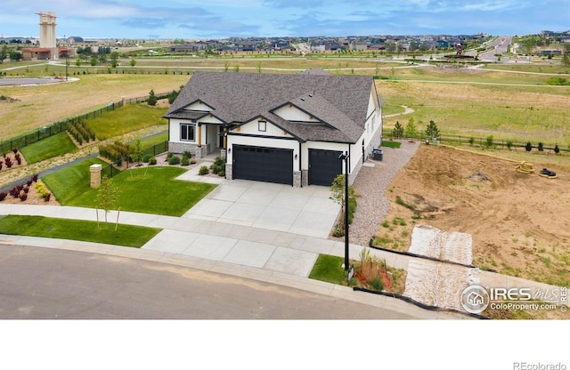 24113 E 36th Pl, Aurora, CO 80019 - view of front of house with an attached garage, driveway, a front yard, a shingled roof, and stone siding