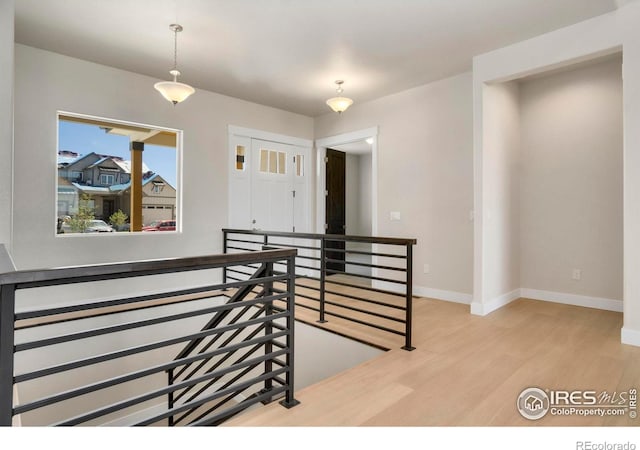 24113 E 36th Pl, Aurora, CO 80019 - stairs featuring wood finished floors and baseboards
