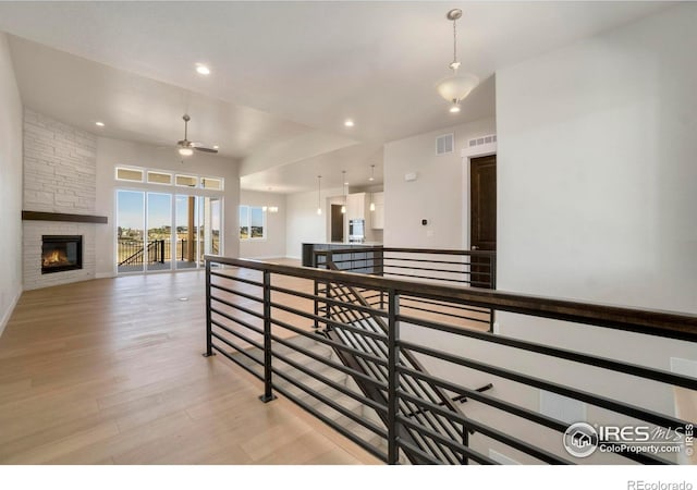 24113 E 36th Pl, Aurora, CO 80019 - hall with an upstairs landing, light wood-style flooring, and recessed lighting