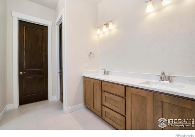 24113 E 36th Pl, Aurora, CO 80019 - bathroom featuring double vanity and tile patterned flooring