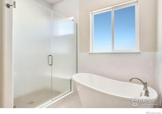 24113 E 36th Pl, Aurora, CO 80019 - bathroom with a soaking tub and a stall shower