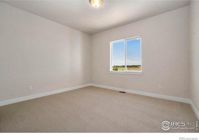 24113 E 36th Pl, Aurora, CO 80019 - unfurnished room featuring light colored carpet and baseboards