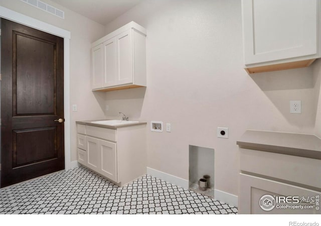 24113 E 36th Pl, Aurora, CO 80019 - laundry area featuring electric dryer hookup, cabinet space, and hookup for a washing machine