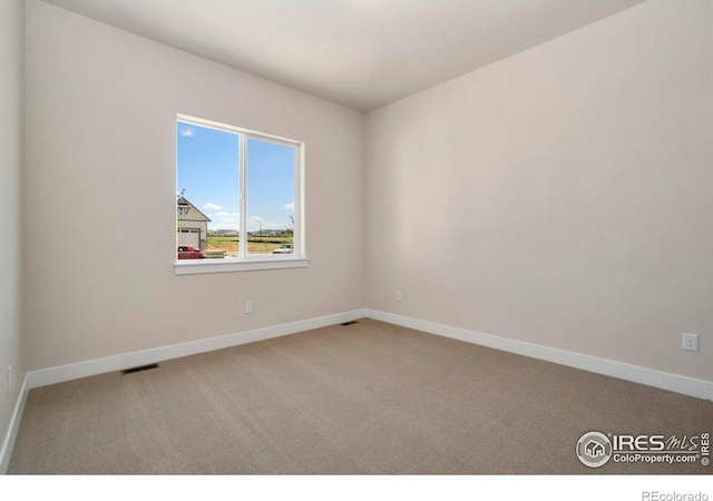 24113 E 36th Pl, Aurora, CO 80019 - spare room featuring carpet flooring