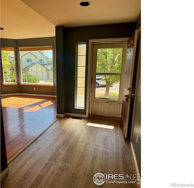 2395 Sandpiper Dr, Lafayette, CO 80026 - doorway to outside with wood finished floors and baseboards