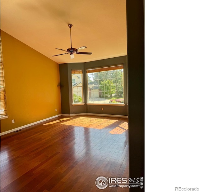 2395 Sandpiper Dr, Lafayette, CO 80026 - empty room featuring wood-type flooring, ceiling fan, and vaulted ceiling